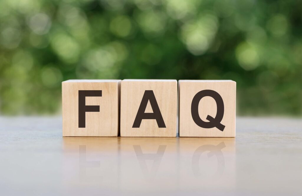 FAQ letter on block cubes on the wooden table 