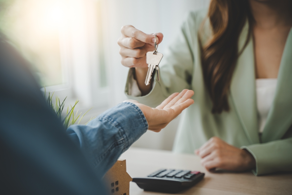Photo of Agent Giving Key